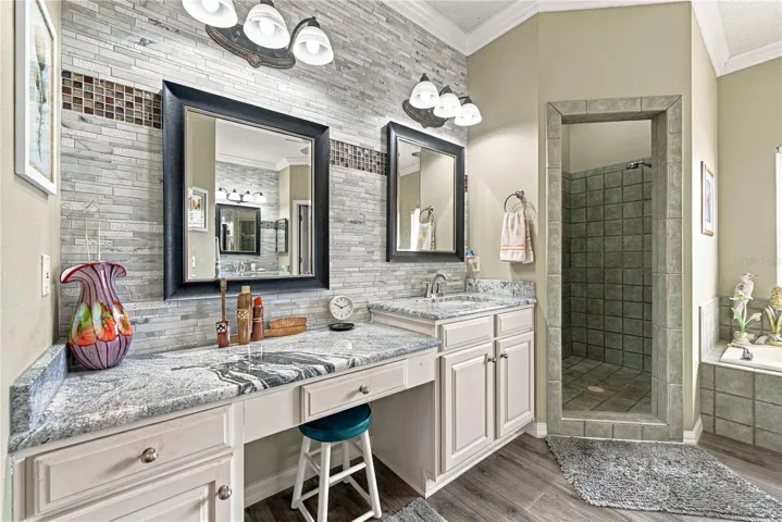 The primary bath has been recently remodeled and features separate vanities.