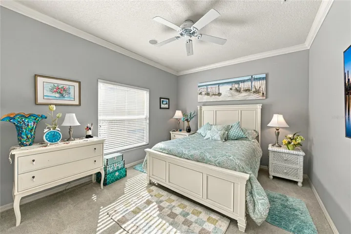 The second bedroom is in the east wing and features quality carpeting, ceiling fan, and large reach in closet.