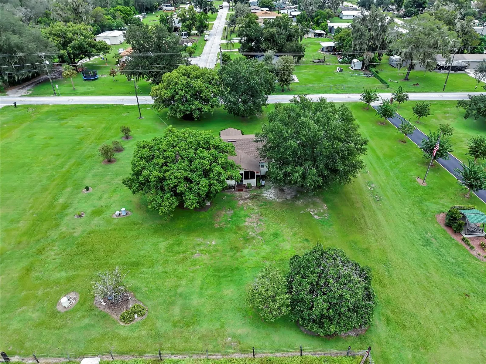1 acre lot Turner Rd frontage , ( .99) includes the house, well , septic, Oaks  and fruit trees.