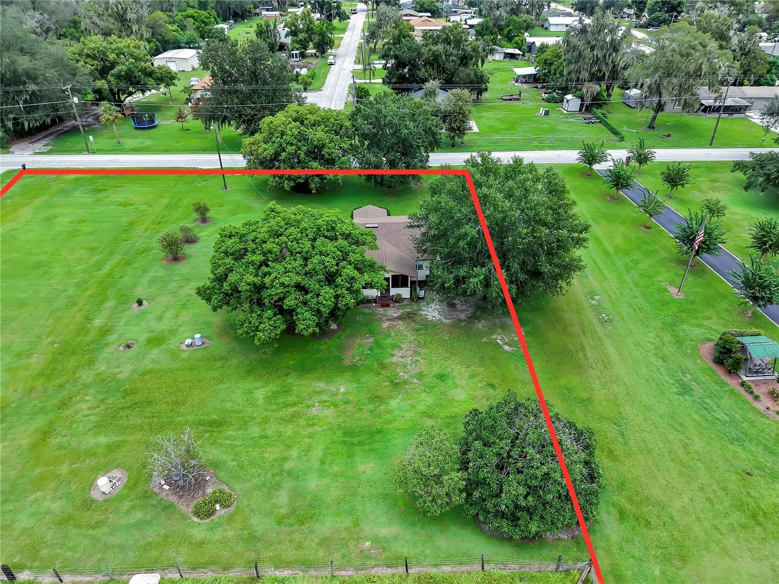 Front .93 acre lot with home