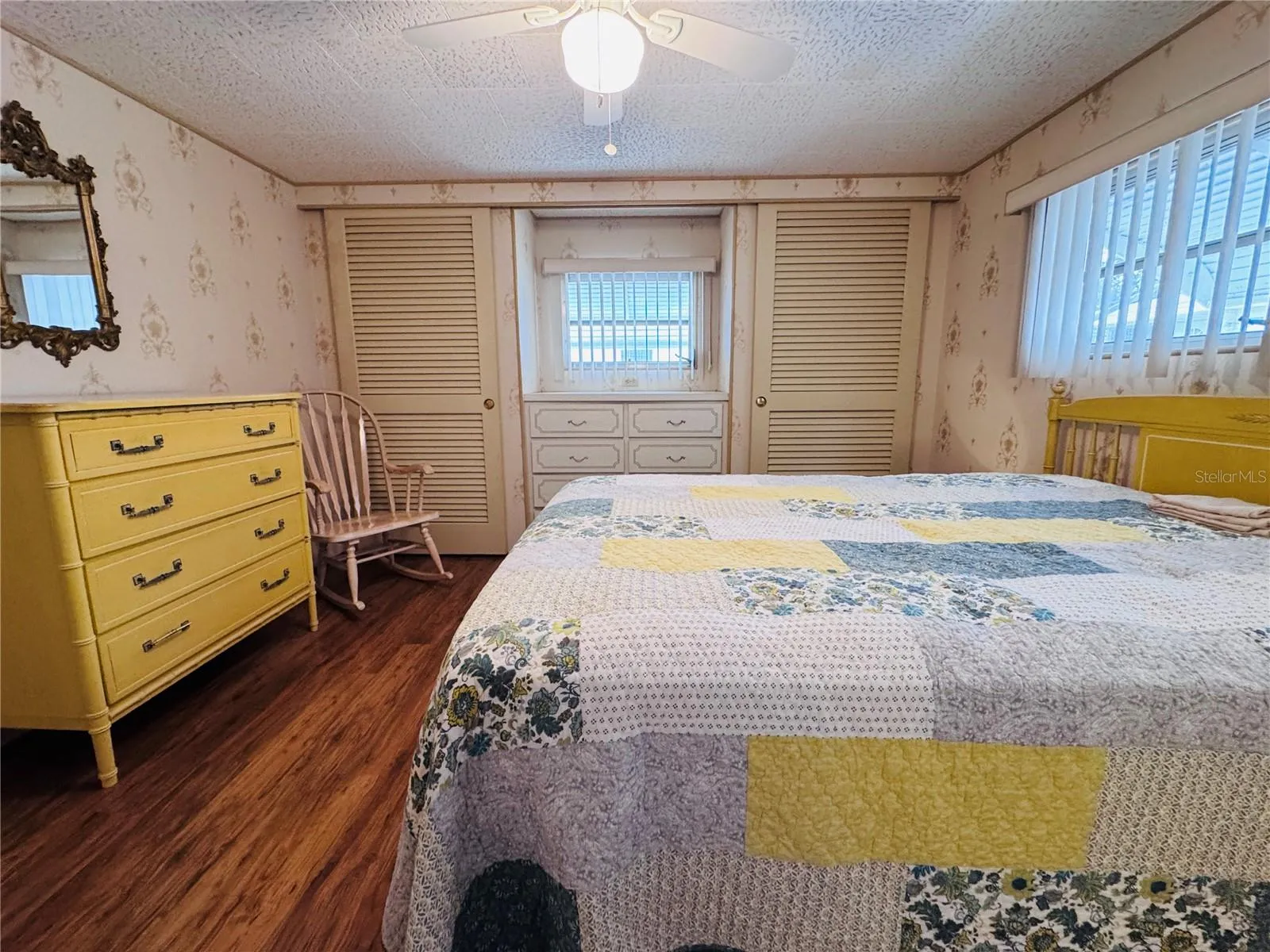 Primary Bedroom with two built in closets and a built in dresser.
