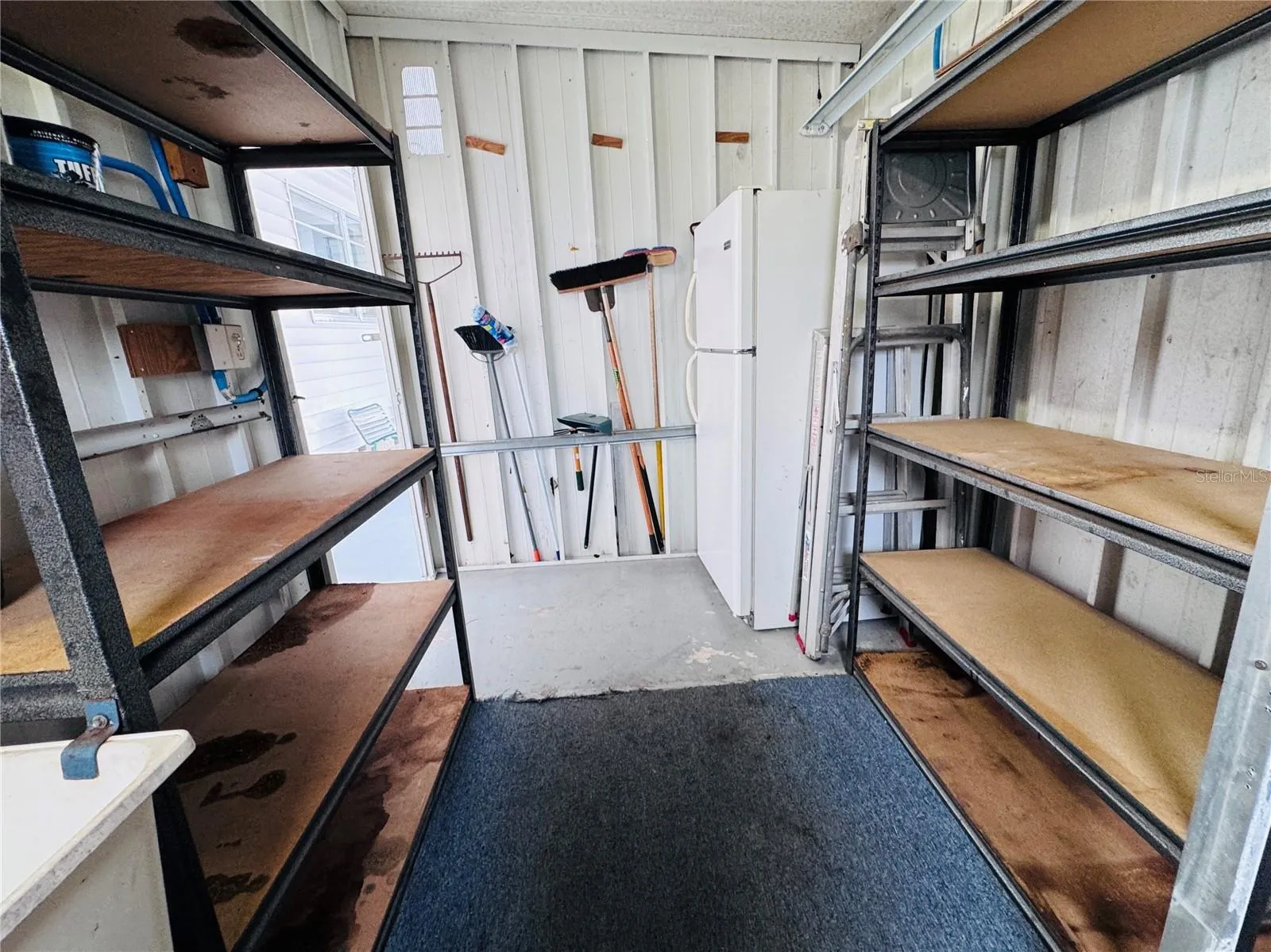 Lots of storage located in the shed located on the carport.