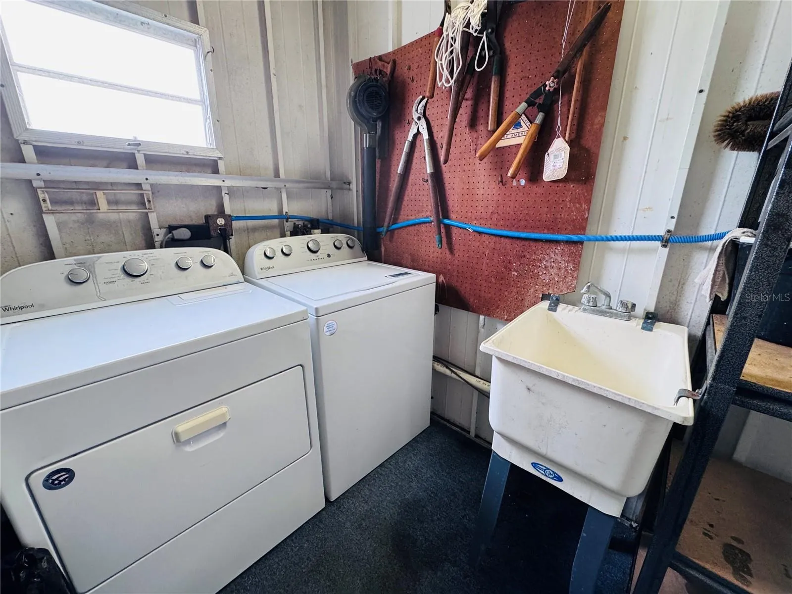 Washer and dryer located in the shed.