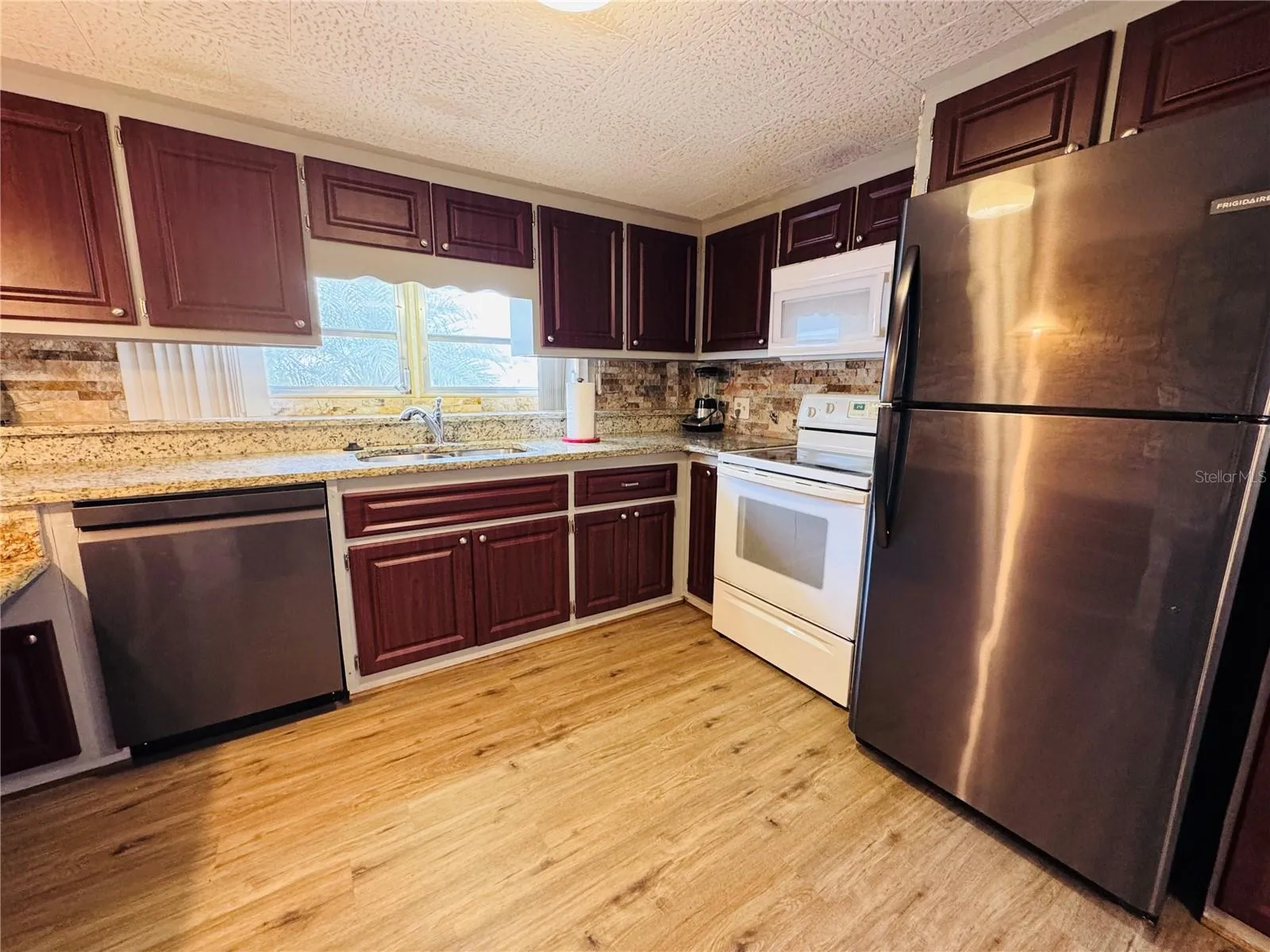 Grante counters with stainless steel appliances.