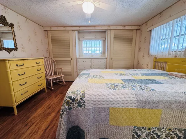 Primary Bedroom with two built in closets and a built in dresser.