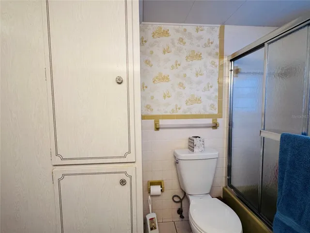 Full bathroom located in the hallway.