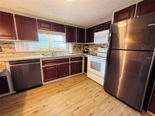 Grante counters with stainless steel appliances.