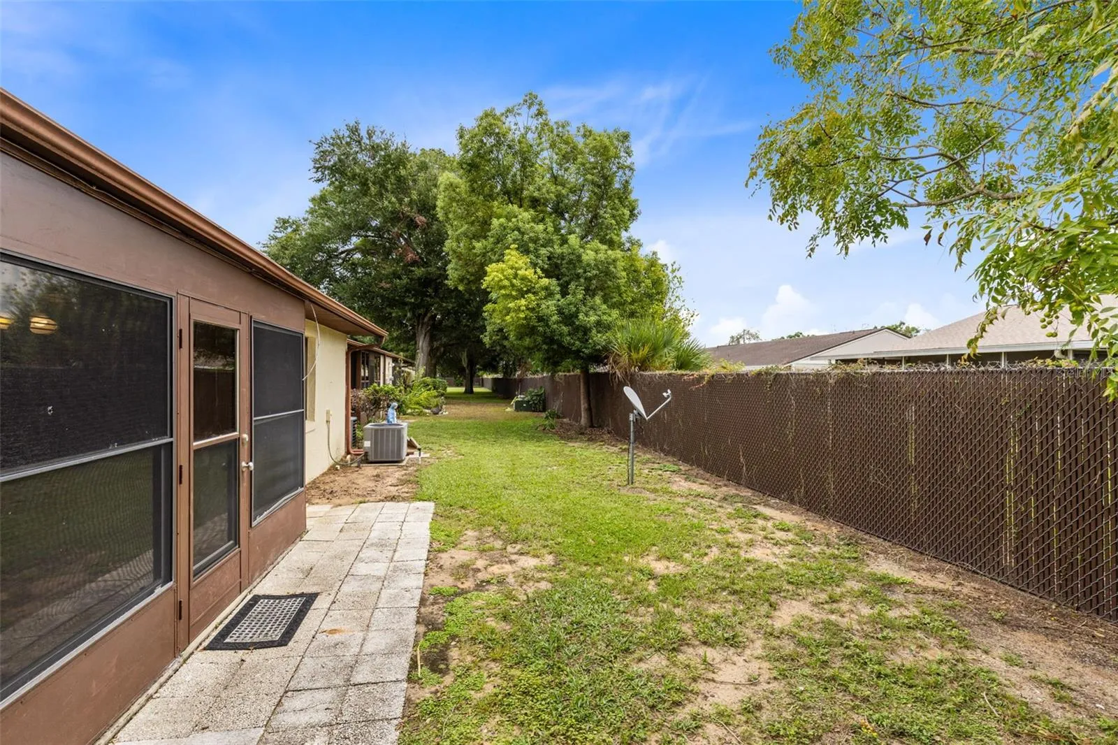 Rear exterior lawn and pavers