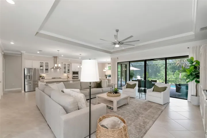 great room with tray ceilings