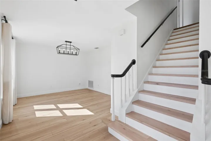 Updated Laminate Flooring &amp; Custom Stairs