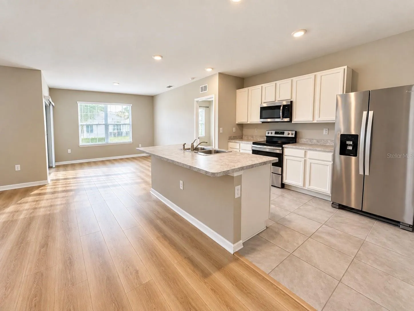 Spacious living area with beautiful new flooring