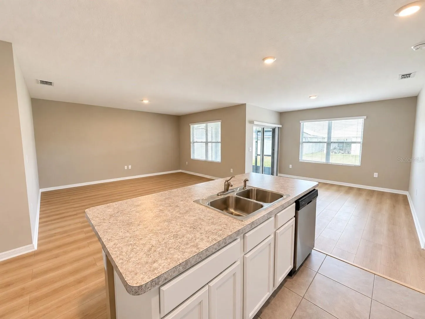 Spacious living area with beautiful new flooring