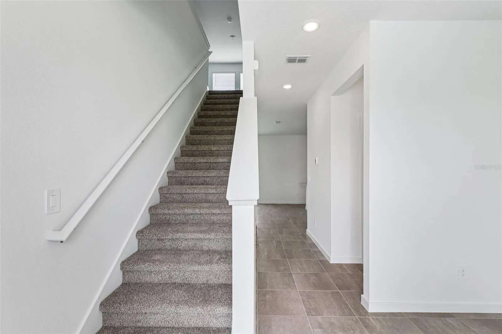 The interior photos are of another home with the same floor plan but different interior color package finishes. Some details may vary