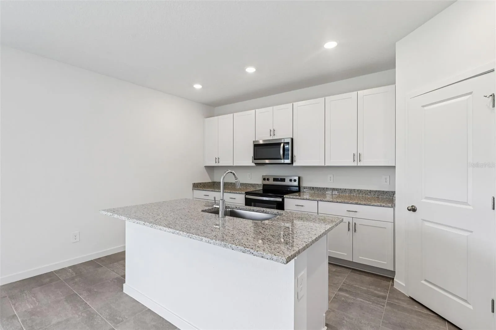 The interior photos are of another home with the same floor plan but different interior color package finishes. Some details may vary