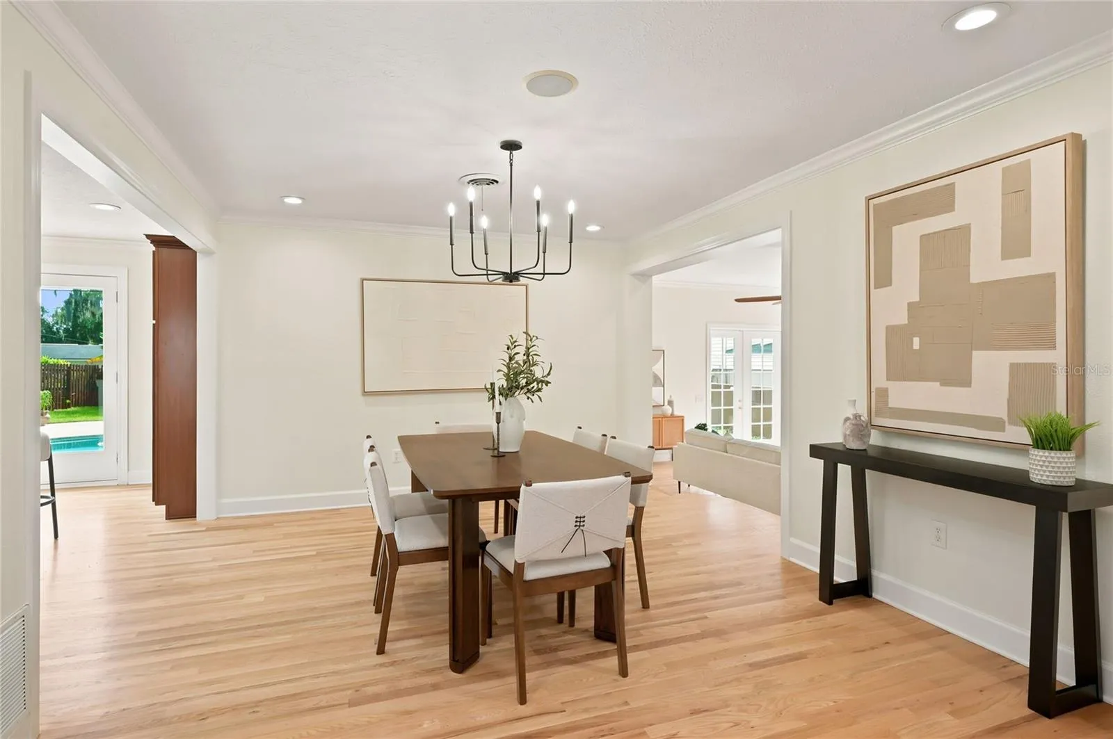 Dining space with crown molding, cased openings & new recessed lighting