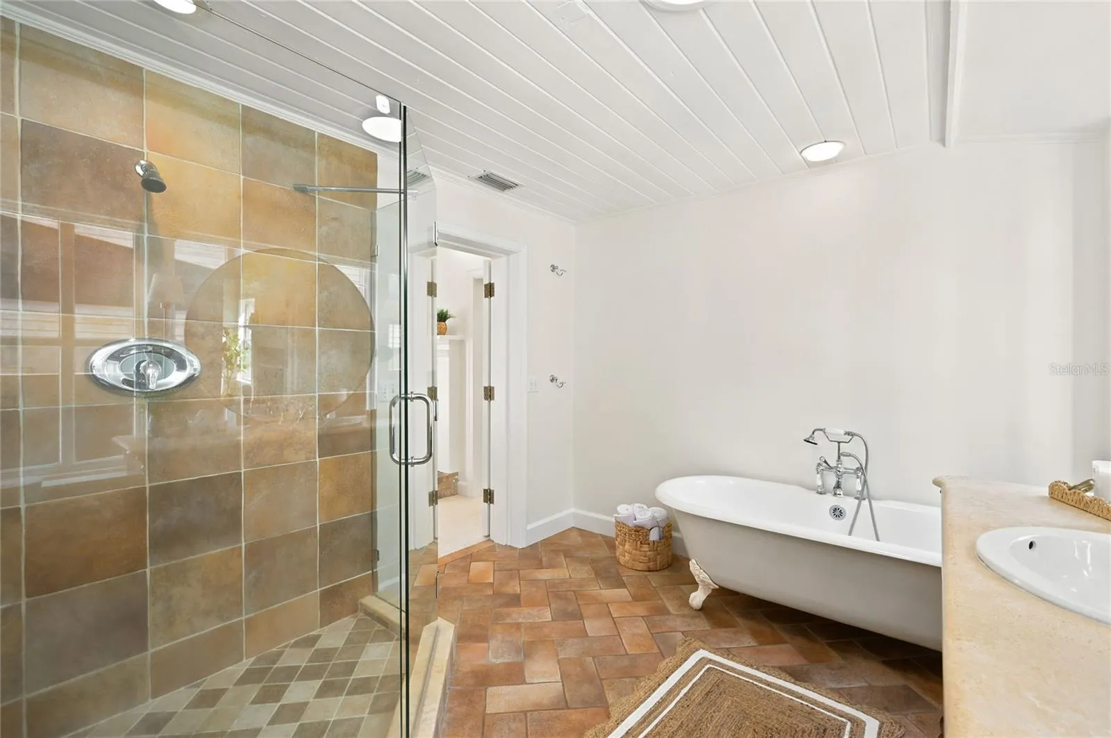 Owners suite bath with walk in glass enclosed shower