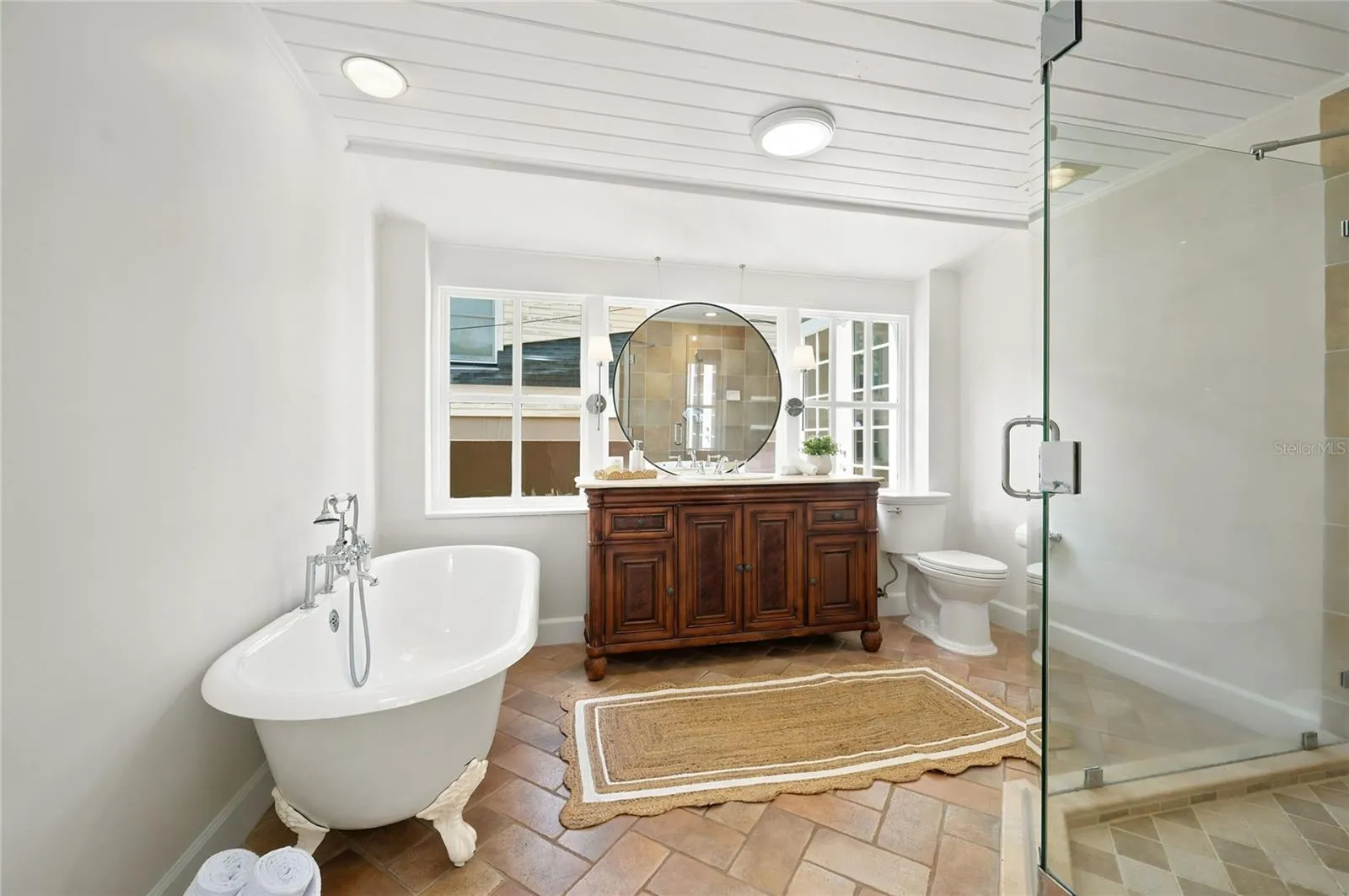 Owner's suite bath with custom furniture piece vanity