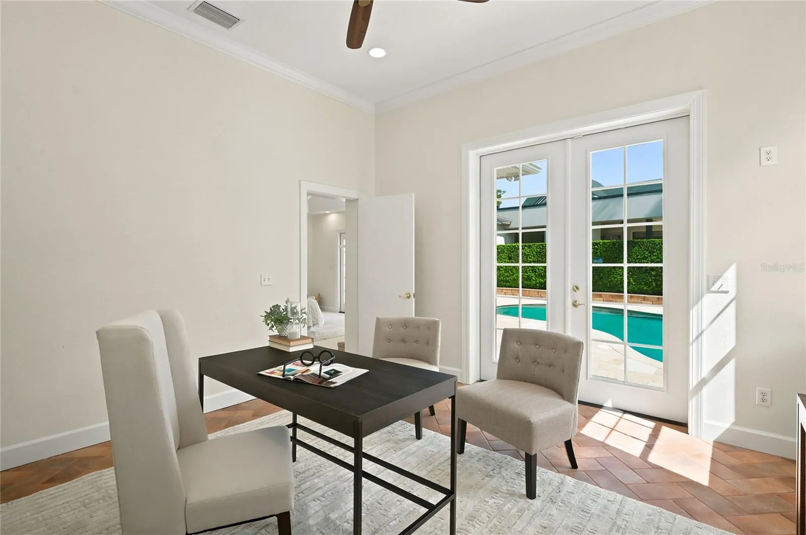 Office/Bonus room or work out space with a  pool view
