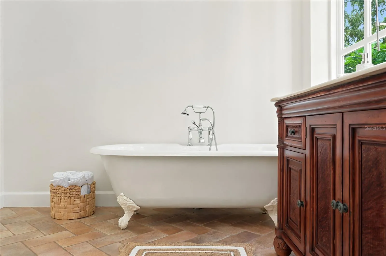 Owner's suite bath with claw foot soaking tub