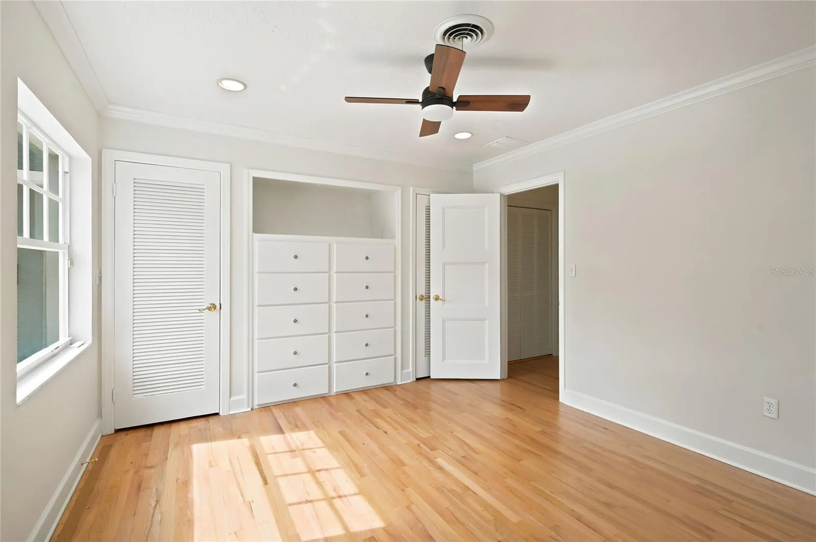 Bedroom 3 with 2 closets and built-in dresser