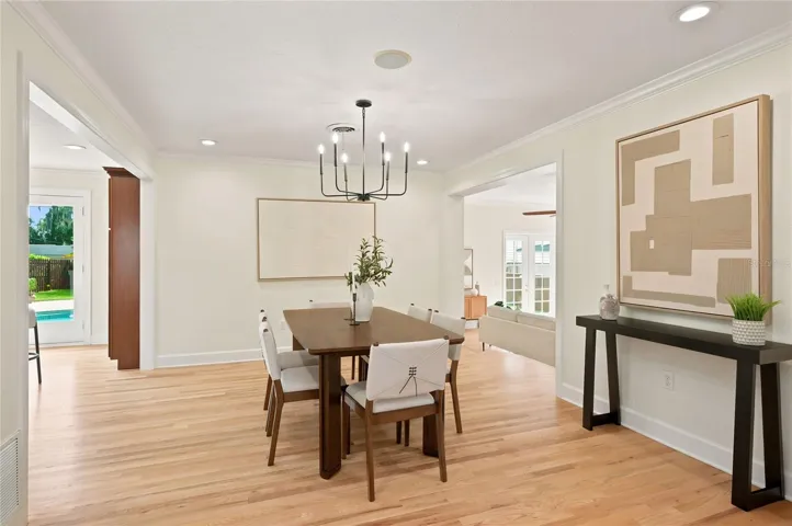 Dining space with crown molding, cased openings & new recessed lighting