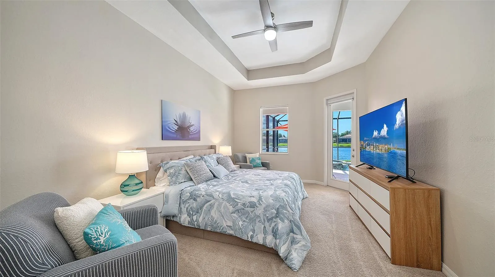 Primary bedroom with entrance to lanai and two walk in closets