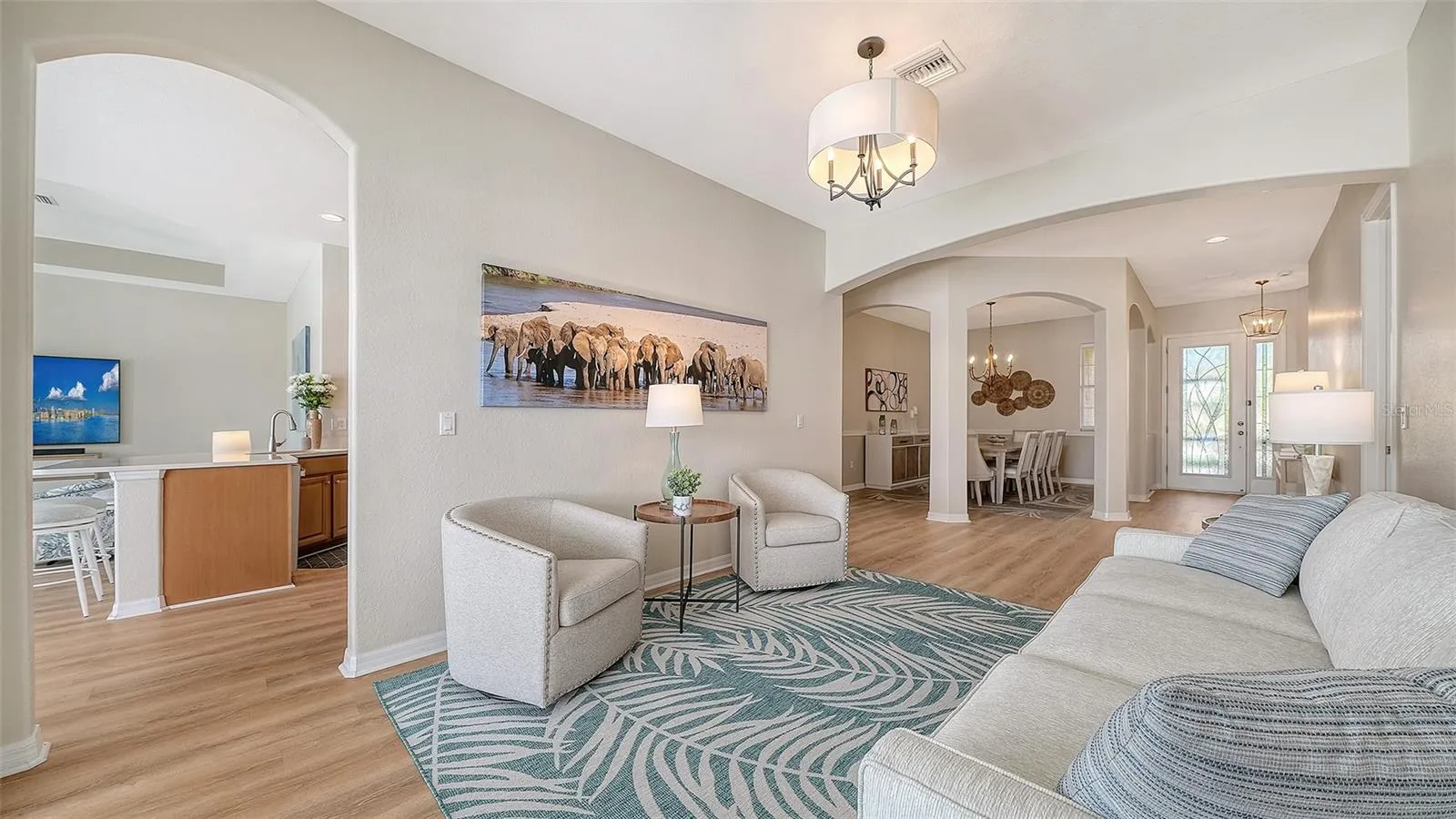 Living room flows easily into the kitchen, family room and dining room