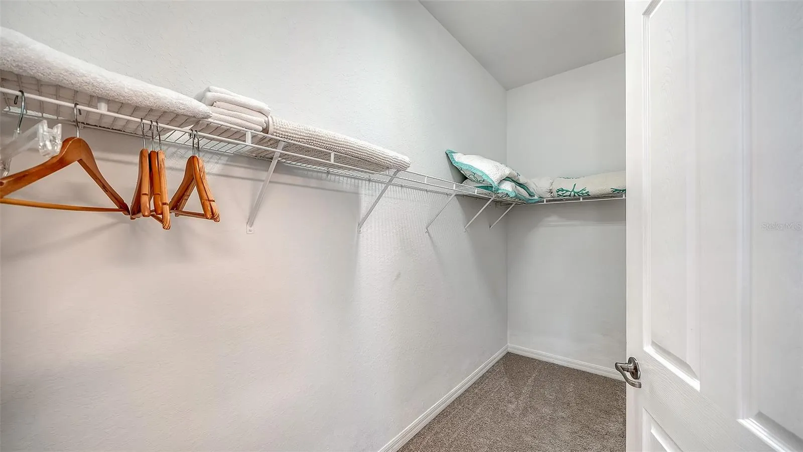 Super large walk in closet in primary bathroom
