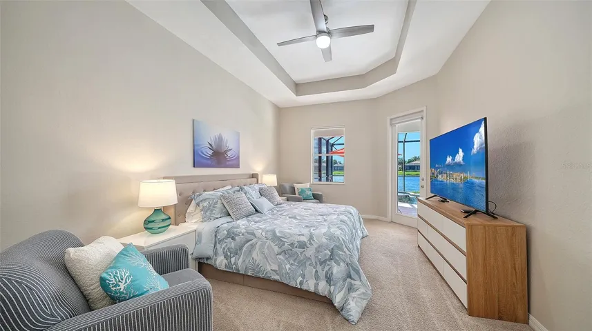Primary bedroom with entrance to lanai and two walk in closets