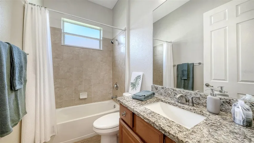Guest bathroom with upgraded countertop, sink and faucets