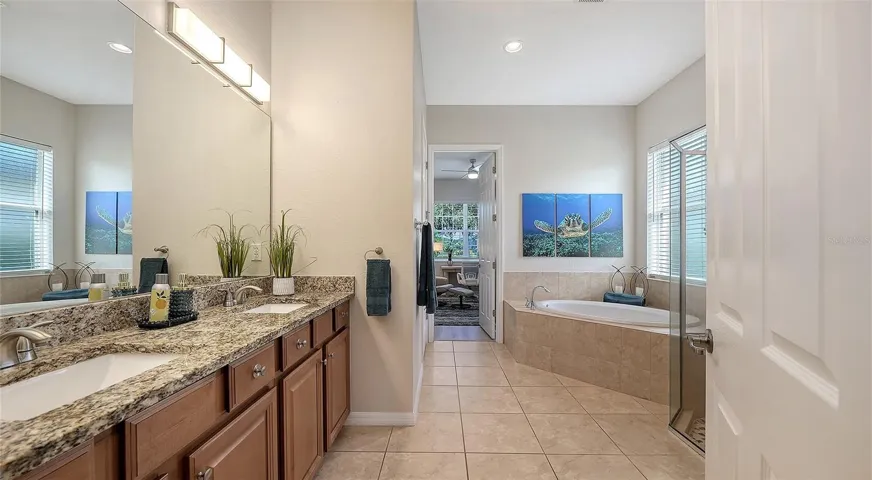 Primary bath with soaking tub, separate shower and extra large walk in closet