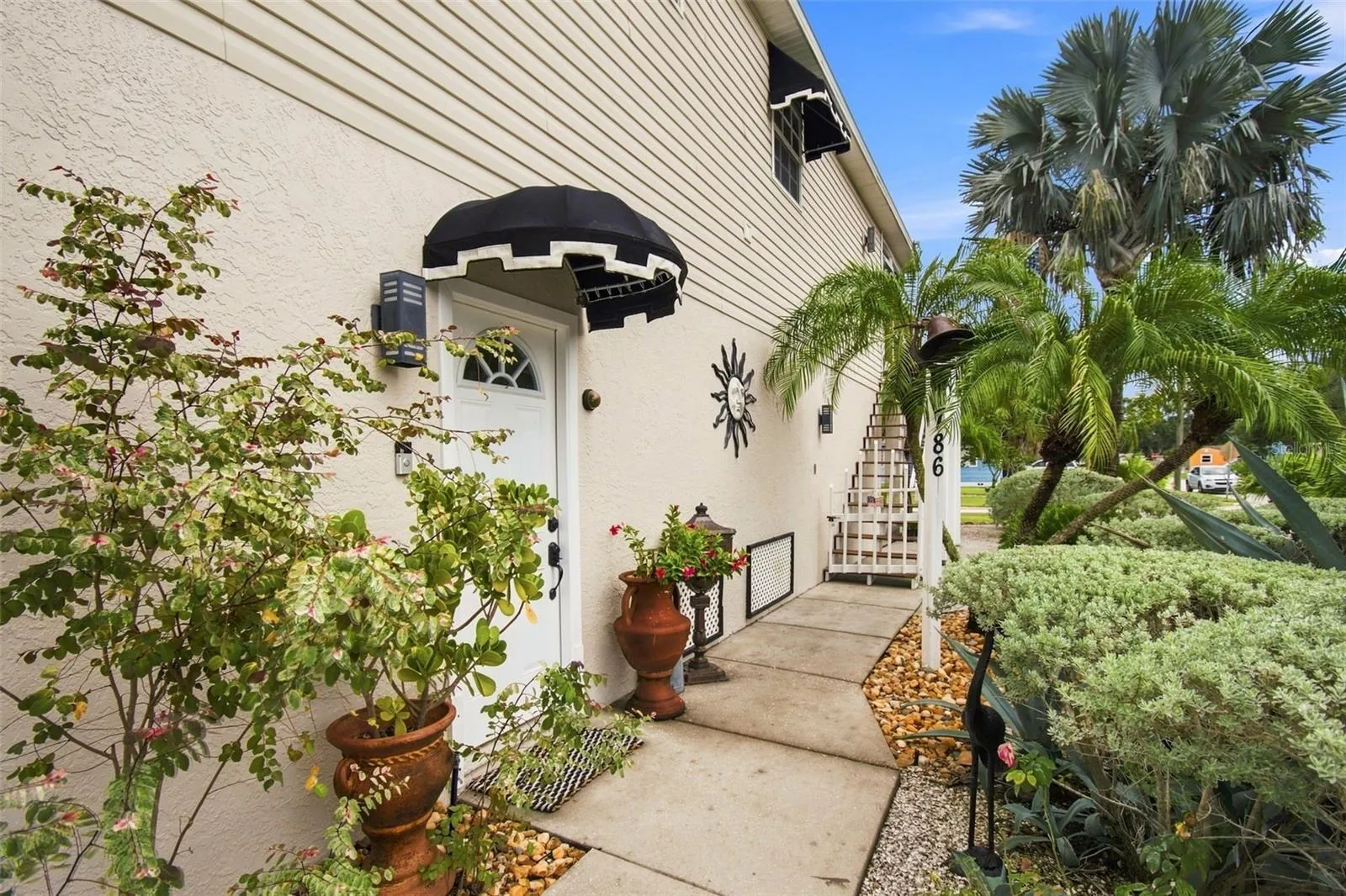 Walkway to downstairs patio and stairs to second floor balcony.