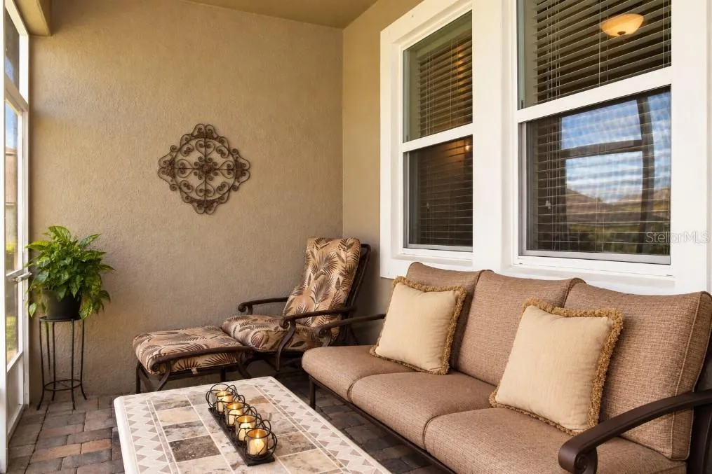 Enclosed, screened porch (ceiling fan above)