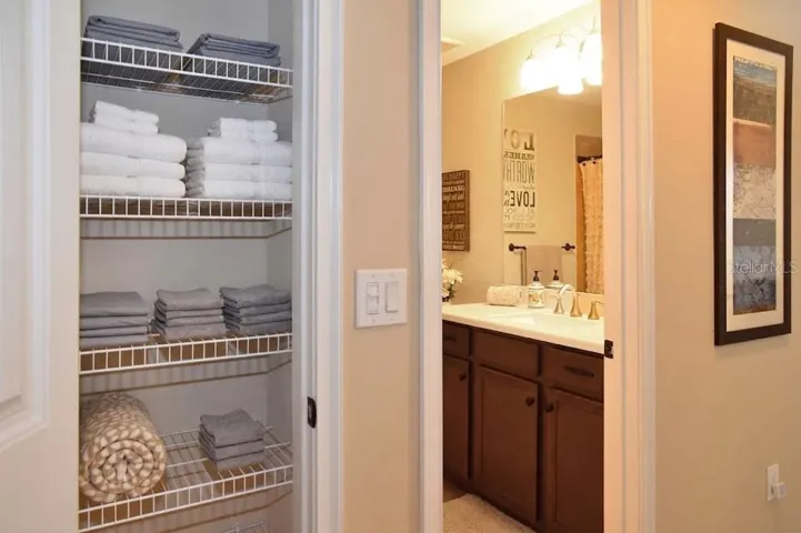 Hall linen closet, upper full bath