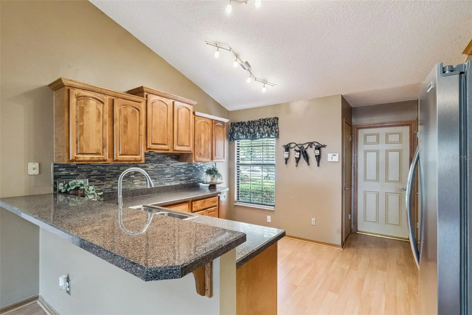 A kitchen view with the garage door entry.