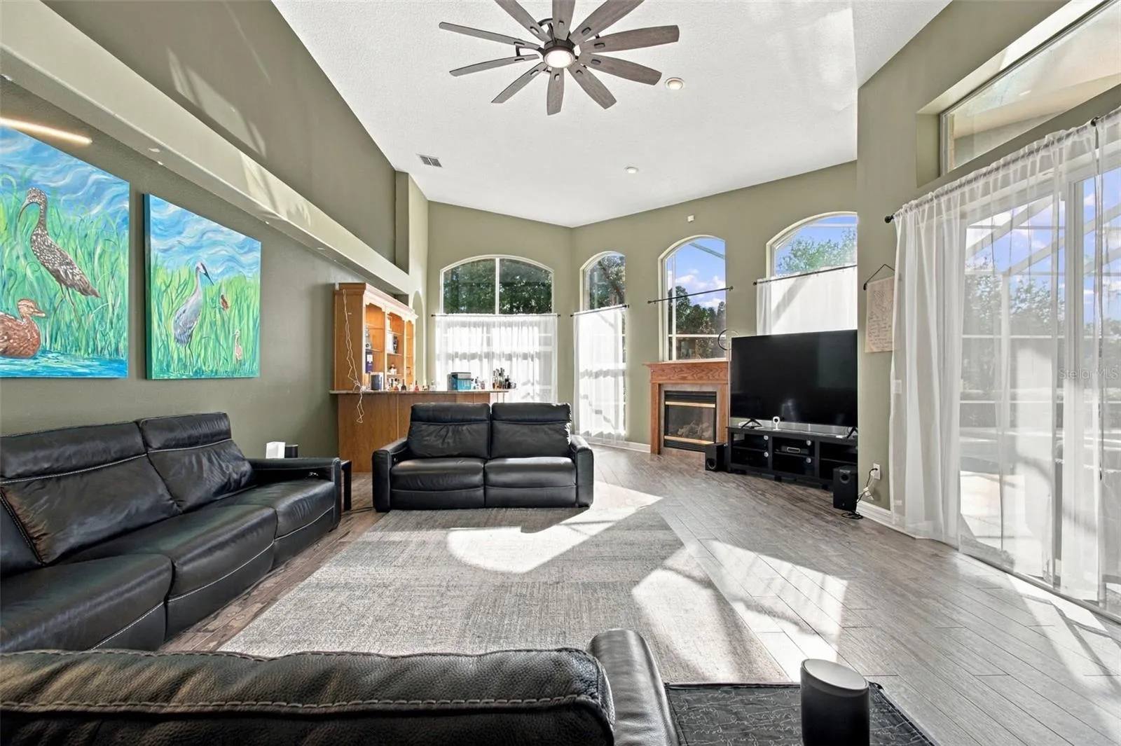 Expansive Family Room with Floor-Ceiling Windows &amp; wet-bar