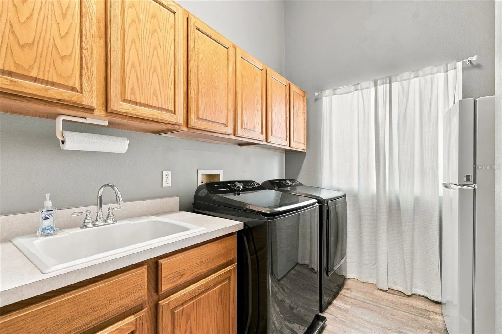 Spacious Laundry Room with Laundry Sink &amp; plenty of room for Bulk Storage