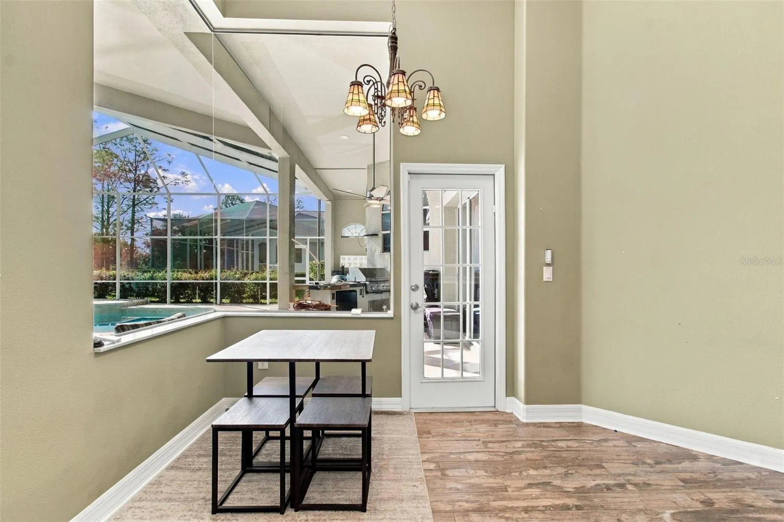 Casual Dining Room overlooks the pool &amp; natural Florida landscape