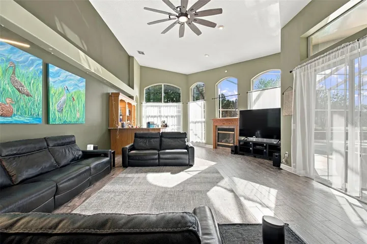 Expansive Family Room with Floor-Ceiling Windows &amp; wet-bar