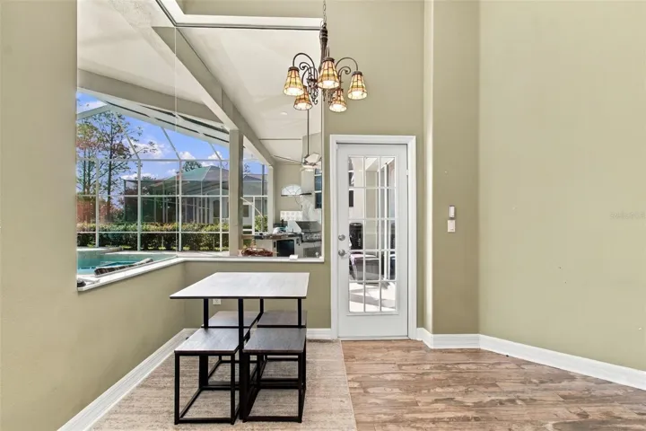 Casual Dining Room overlooks the pool &amp; natural Florida landscape