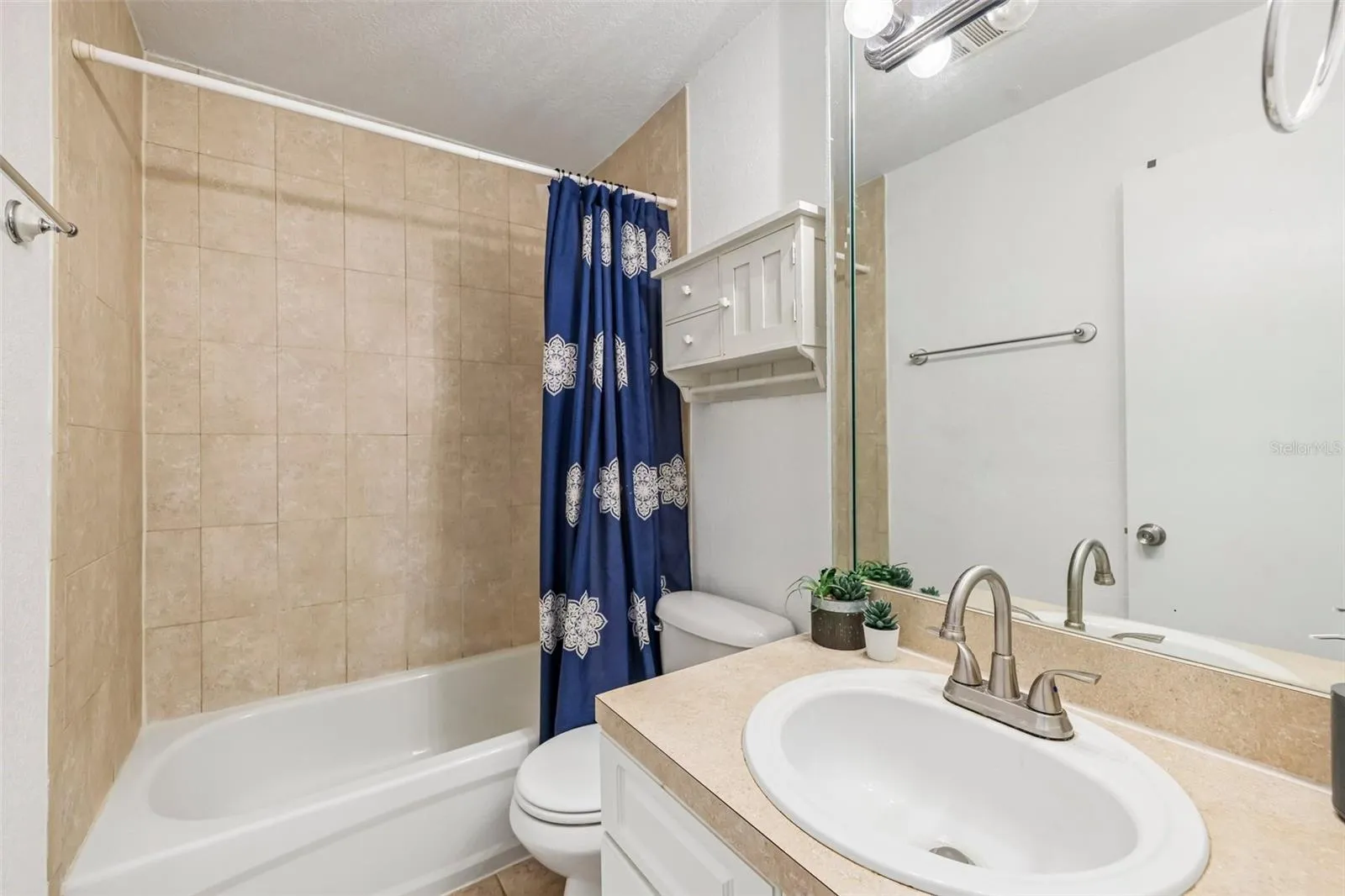 Guest bath accessible through hall