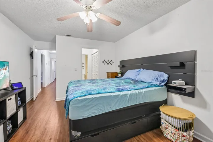 Primary bedroom with laminate flooring