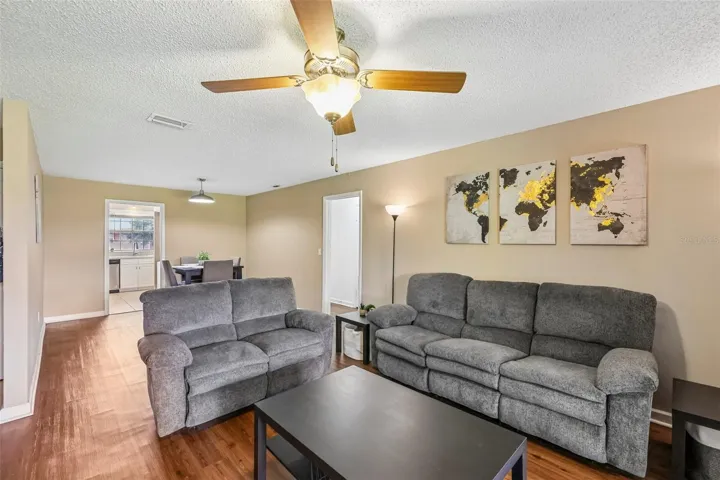 As you walk into the condo, you enter the spacious living room.