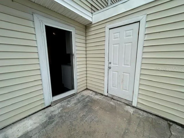 Kitchen door leading to patio & storage closet