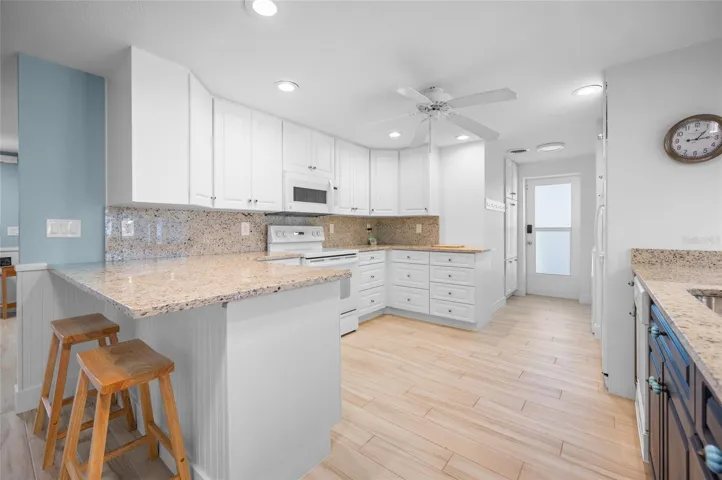 Spacious kitchen with GRANITE COUNTER TOPS &amp; BREAKFAST BAR