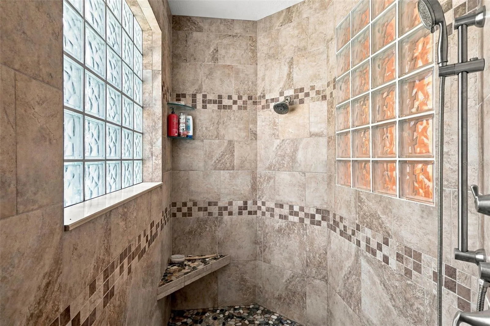 WALK IN SHOWER IN THE PRIMARY ROOM