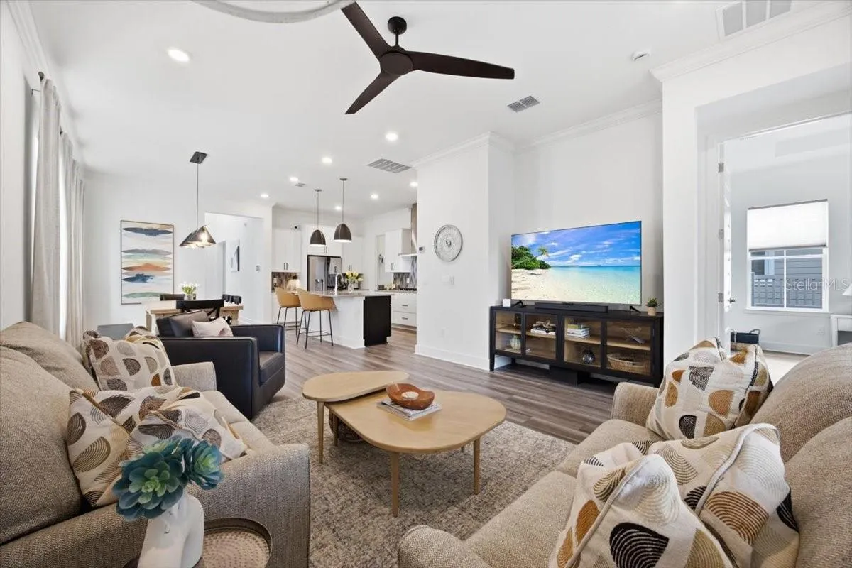 Open-concept kitchen, dining, and living spaces flow together beautifully
