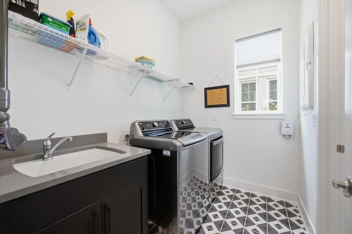 Laundry Room on 1st floor - conveniently next to Kitchen and connected to Primary Bedroom's Closet
