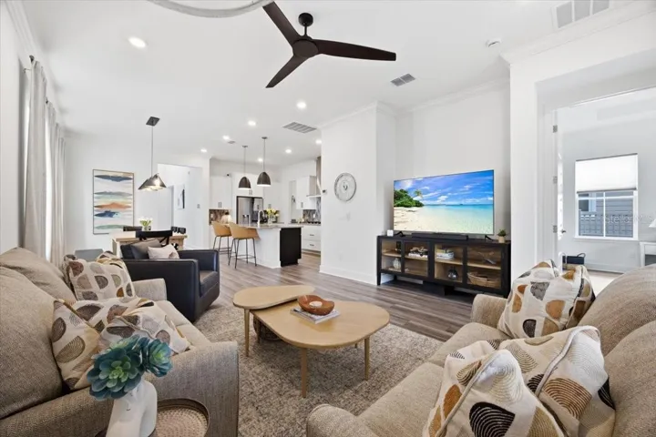 Open-concept kitchen, dining, and living spaces flow together beautifully
