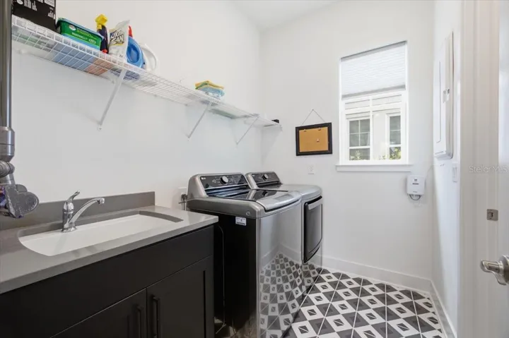 Laundry Room on 1st floor - conveniently next to Kitchen and connected to Primary Bedroom's Closet